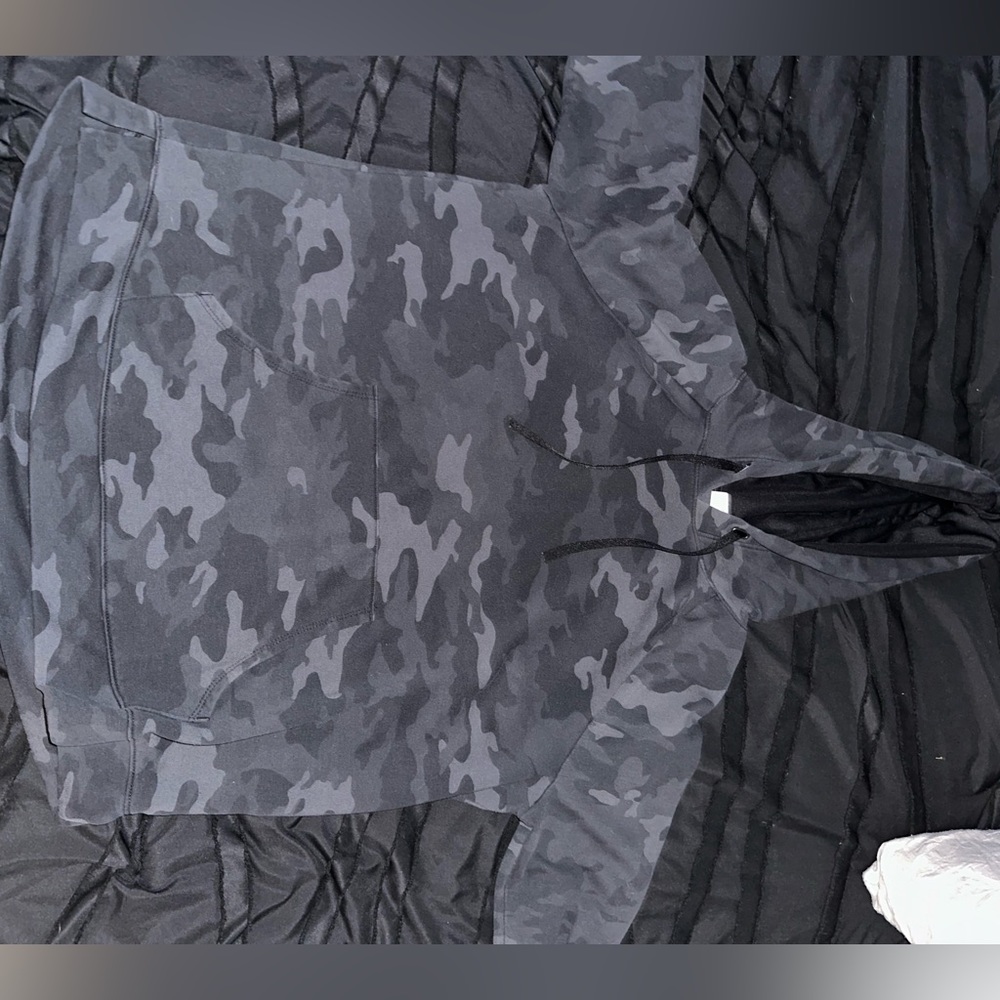 It is a black camouflage hoodie. Size large.